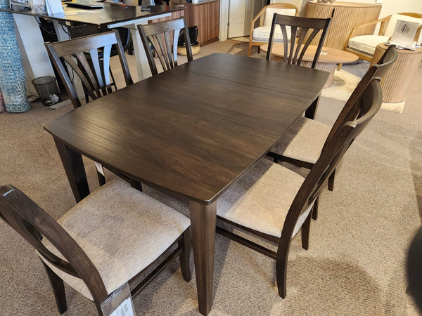 The Handstone Parker 7pc Dining Package offers a rustic aesthetic with a dark wood table and six upholstered chairs.