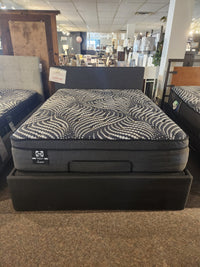 The Julien Beaudoin Ergo Box Adjustable Frame holds a black and gray mattress—ideal for maximizing storage space.