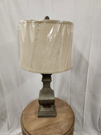 The Pacific Coast Wilmington 60G46 Table Lamp with a washed grey base adds modern style to your home decor.