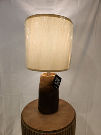 The Pacific Coast 87-8115-21 Scarlet Oak Table Lamp with beige shade is ideal for stylish home decor.