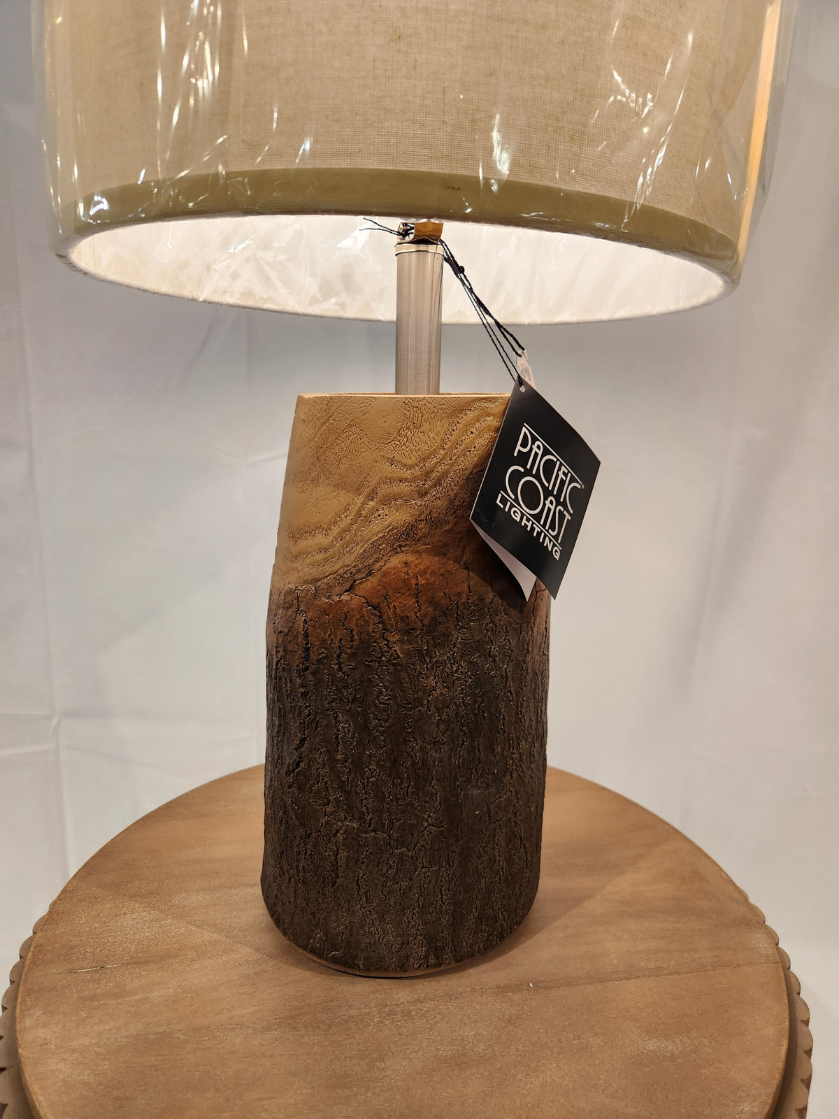 Pacific Coast 87-8115-21 Scarlet Oak Table Lamp with wooden base and beige shade adds charm to your home decor.