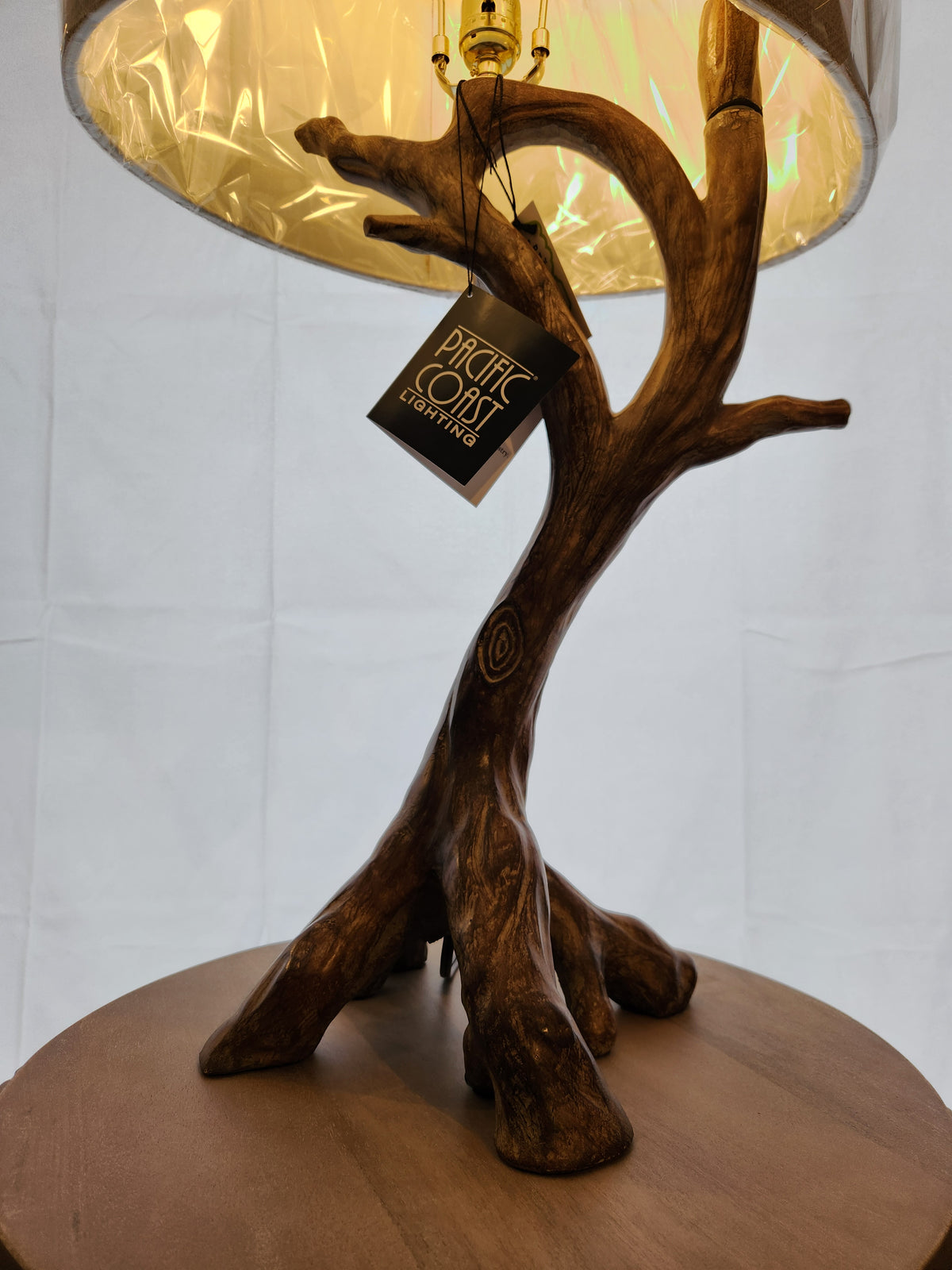 The Pacific Coast 87-8036-48 Beachwood Table Lamp features a branch-like faux wood base and a burlap shade.