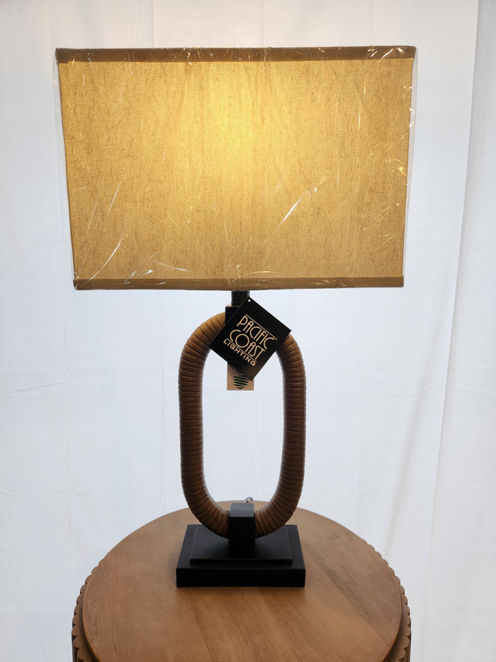 The Pacific Coast 310C1 Egan Table Lamp set of 2 adds nautical charm on a round wood table against a white backdrop.