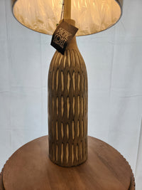 73E50 Stonewall Table Lamp by Pacific Coast: hand-carved with vertical patterns and a round base.