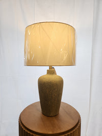 The Pacific Coast 861D0 Reid Table Lamp features a beige ceramic urn base, ideal for modern decor.