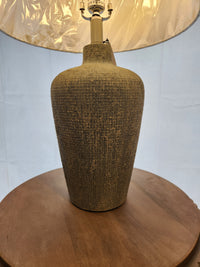 The Pacific Coast 861D0 Reid Table Lamp with a textured ceramic base is perfect for modern decor.