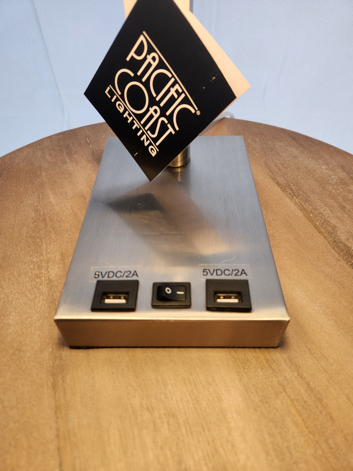 The Pacific Coast 902c0 Elton Table Lamp has a rectangular brushed nickel base with USB ports and power switch.