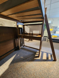Crate B43200 Versa Loft Bed, crafted from Southern Yellow Pine with desk and ladder, displayed in showroom.