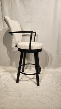 The Amisco Cardin Counter Height Bar Stool features a modern light gray upholstered seat, antiqued black frame, backrest, and footrest.