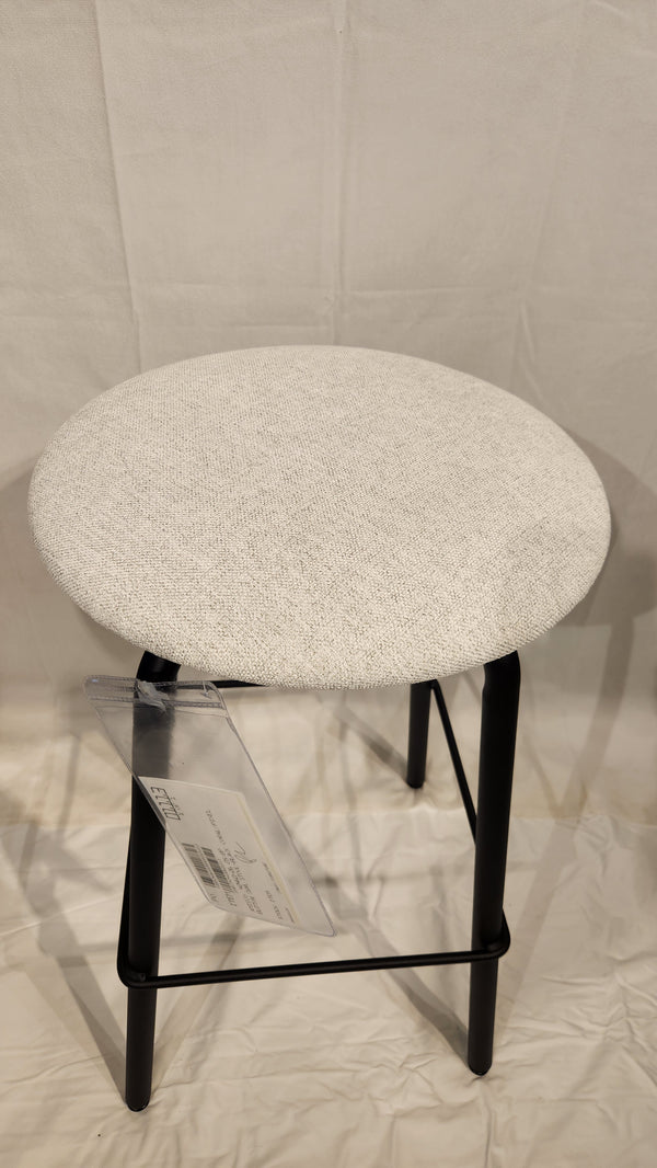 The Amisco Button Counter Height Swivel Stool features a round white seat and black metal legs on a light fabric background.