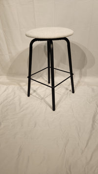 The Amisco Button Counter Height Swivel Stool features light gray upholstery and black metal legs on a white backdrop.