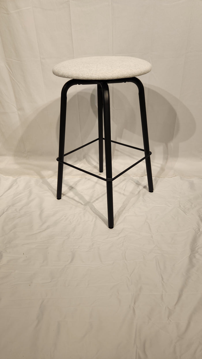 The Amisco Button Counter Height Swivel Stool features light gray upholstery and black metal legs on a white backdrop.