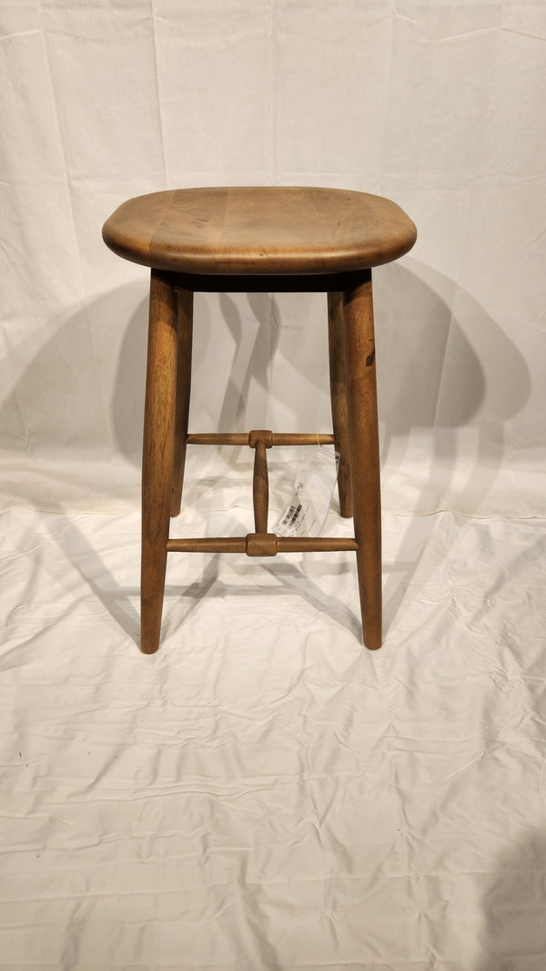 The Ernest Counter Height Bar Stool by Mercana, with four legs and a round seat, sits on a white surface and backdrop.