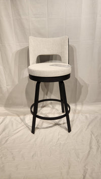 The Amisco Brock Counter Height Swivel Bar Stool features a cushioned seat, dark wood legs, and circular footrest.
