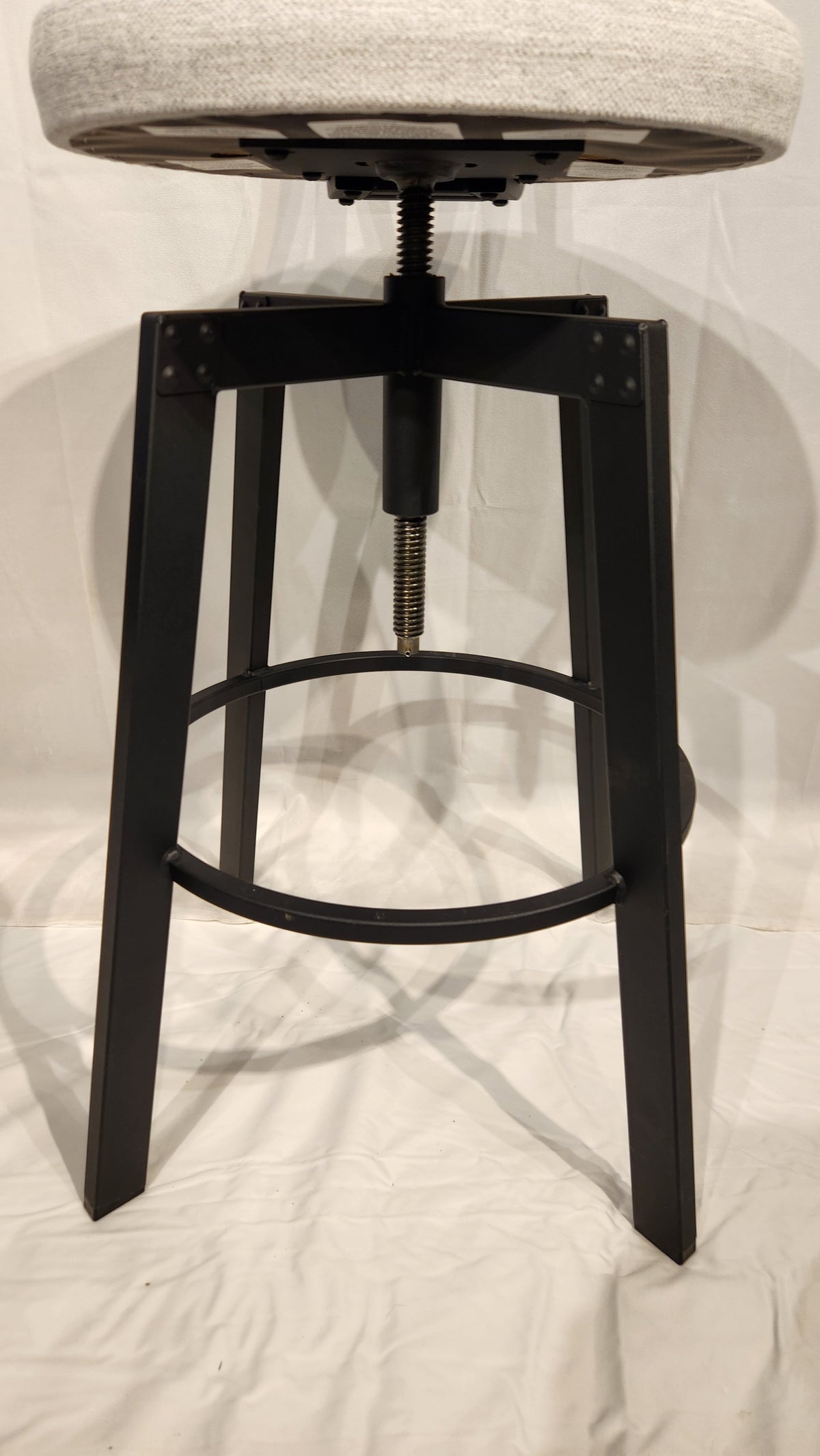 Quebec's Amisco presents the Architect Black Coral Counter Height Stool, a minimalist design with adjustable seat and footrest.