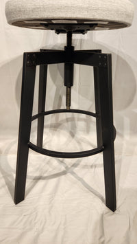 Quebec's Amisco presents the Architect Black Coral Counter Height Stool, a minimalist design with adjustable seat and footrest.