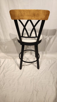 The Amisco Brittany Counter Height Swivel Bar Stool features vintage finishes and a light cushion, shown on a white background.