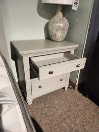 Magnussen B5611 Charleston Nightstand with two drawers and a ceramic lamp—ideal for a modern farmhouse bedroom.