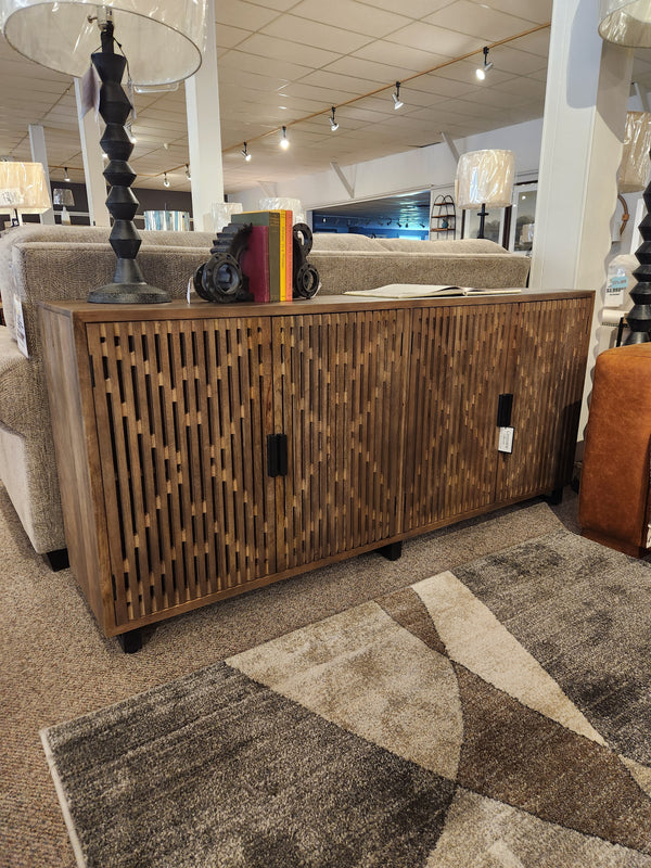 The Crestview Collection Lavelle 4 Door Sideboard is showcased in showrooms in Memphis, Tennessee.