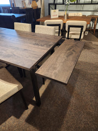 Amisco's Lewis 36"X48" Table Package pairs with upholstered chairs in a modern dining space.