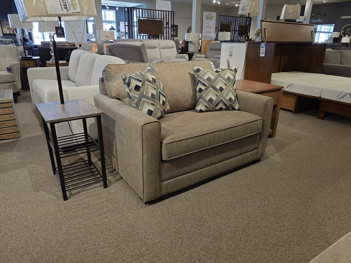 The Simmons Upholstery 1014 Trinity Chair Bed in beige with patterned cushions features a sleeper, ideal for guests.
