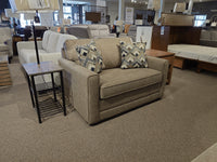 The Simmons Upholstery 1014 Trinity Chair Bed in beige with patterned cushions features a sleeper, ideal for guests.