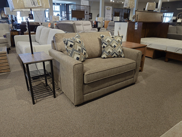 The Simmons Upholstery 1014 Trinity Chair Bed in beige with patterned cushions features a sleeper, ideal for guests.