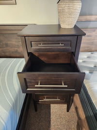Handstone Stockholm 5 Drawer Lingerie Chest with a sleek design, placed between two beds with patterned bedding.