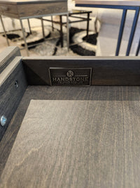 Close-up of a Handstone Muskoka 24" End Table solid oak drawer with logo and "CRAFTED FOR LIFE" plaque.