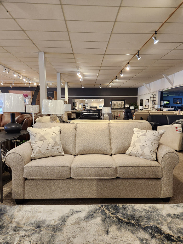 2179 Sofa by Decor-rest: Beige with classic design, two patterned cushions, surrounded by decor under track lighting.