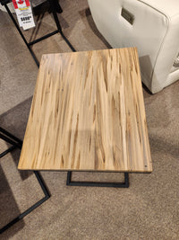 The AlaCarte Snack Table by Handstone features a wooden grain top and metal base.