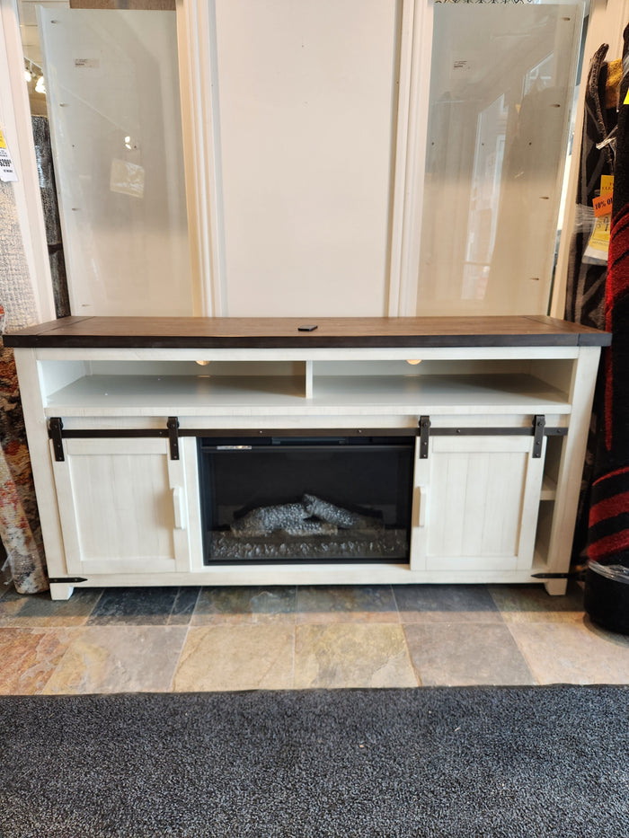 Jofran's Madison Electric Fireplace Mantel: White cabinet, dark top, cozy electric fireplace, sliding barn doors.