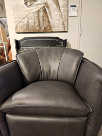 Dark gray Leather Craft 752 Swivel Chair with wide seat and cushioned backrest, in front of an animal portrait artwork.