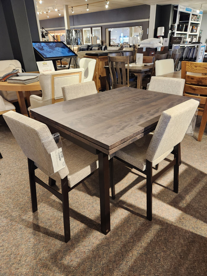 An Alex 36"x 60" solid-top dining package by Amisco features a scratch-resistant wood table & four upholstered chairs.