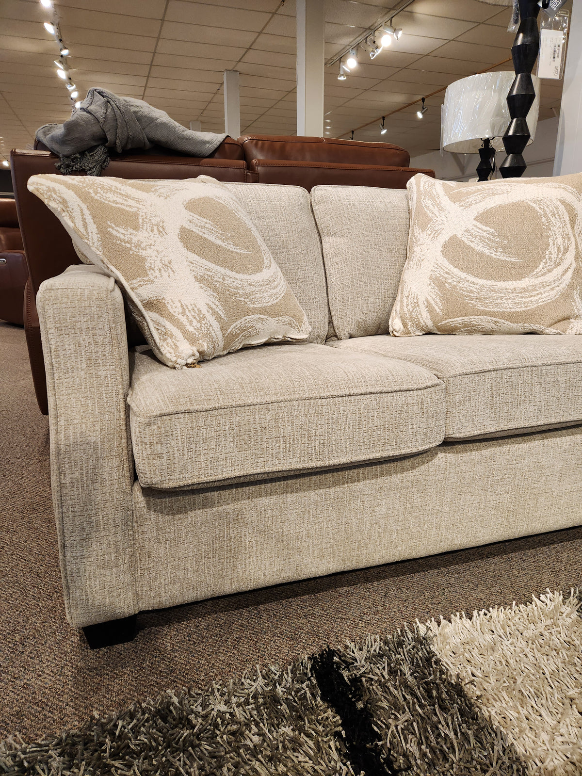 The Decor-rest 2570 Stationary Loveseat, Canadian made in beige, with patterned cushions, perfect for small spaces.