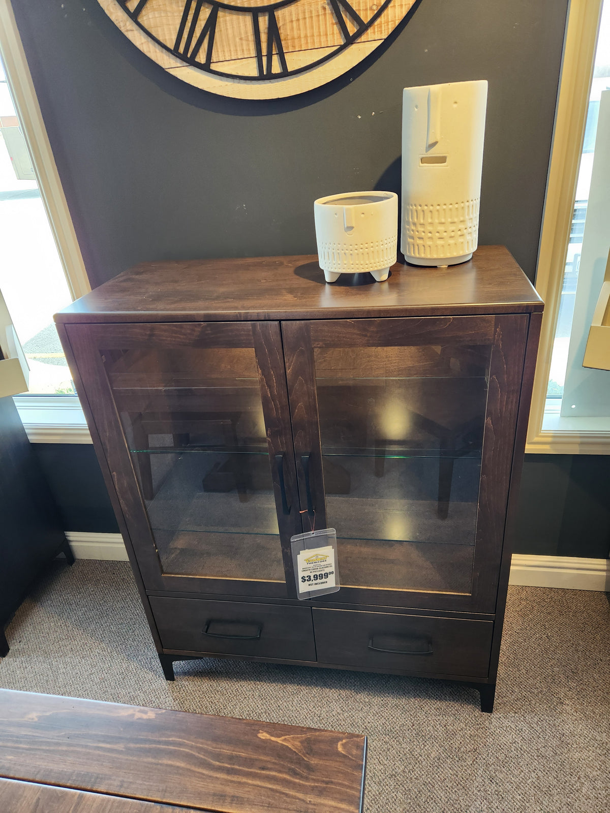 Handstone Laguna Dining Sideboard with Pot Lights, glass doors, ample storage, and ceramic vases on display in showroom.