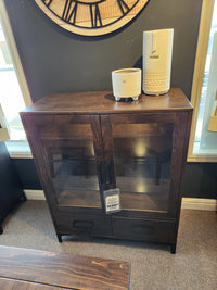 Handstone Laguna Dining Sideboard with Pot Lights, glass doors, ample storage, and ceramic vases on display in showroom.