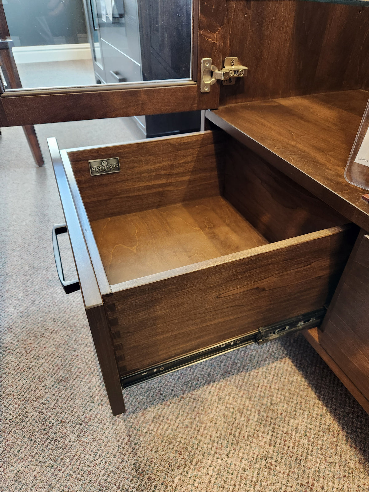 A Laguna Dining Sideboard with Pot Lights by Handstone shows its Smooth Maple Carob finish and metal drawer slides.
