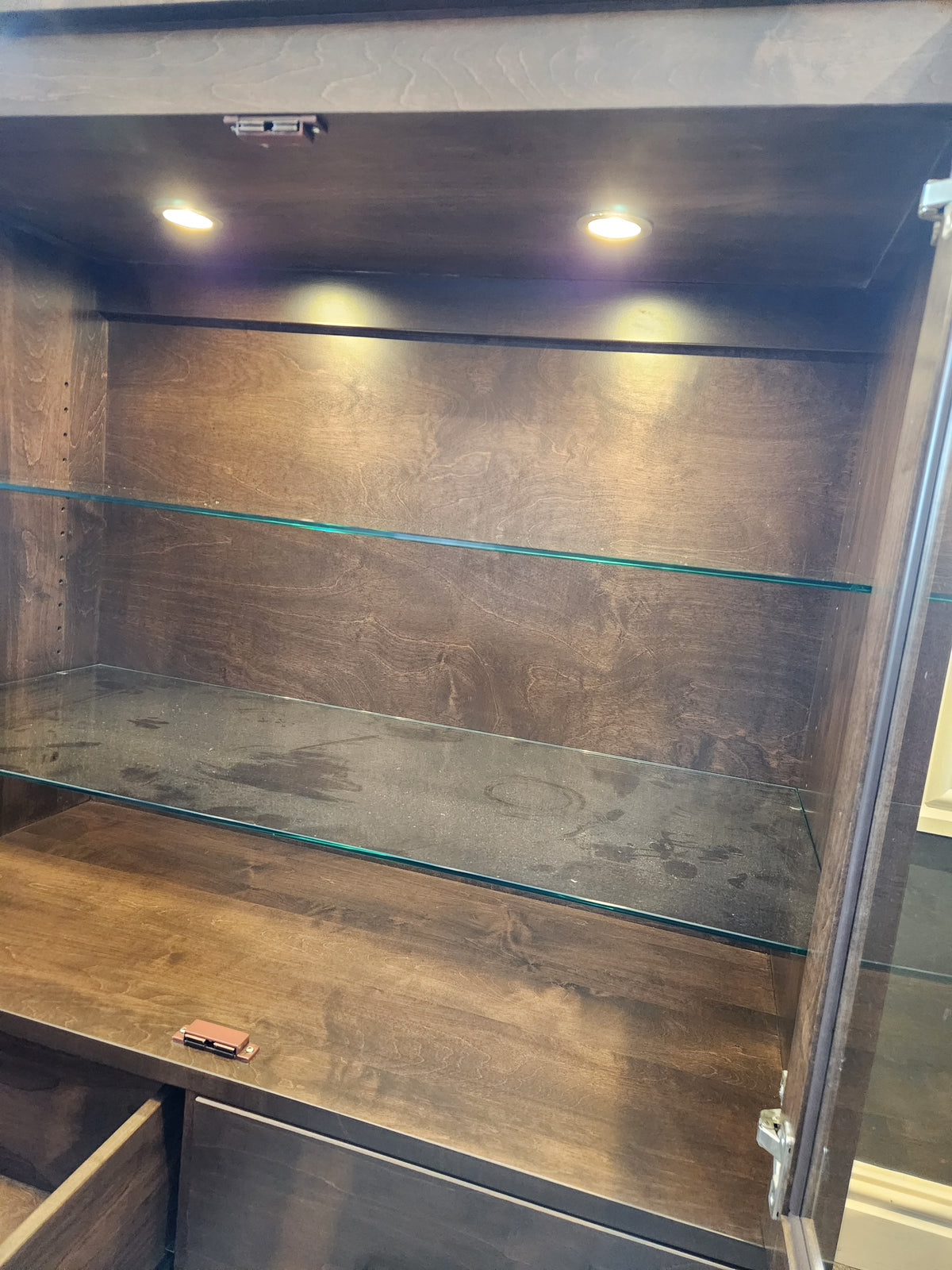 Handstone Laguna Dining Sideboard in Smooth Maple Carob with pot lights, glass shelves, and spacious storage.