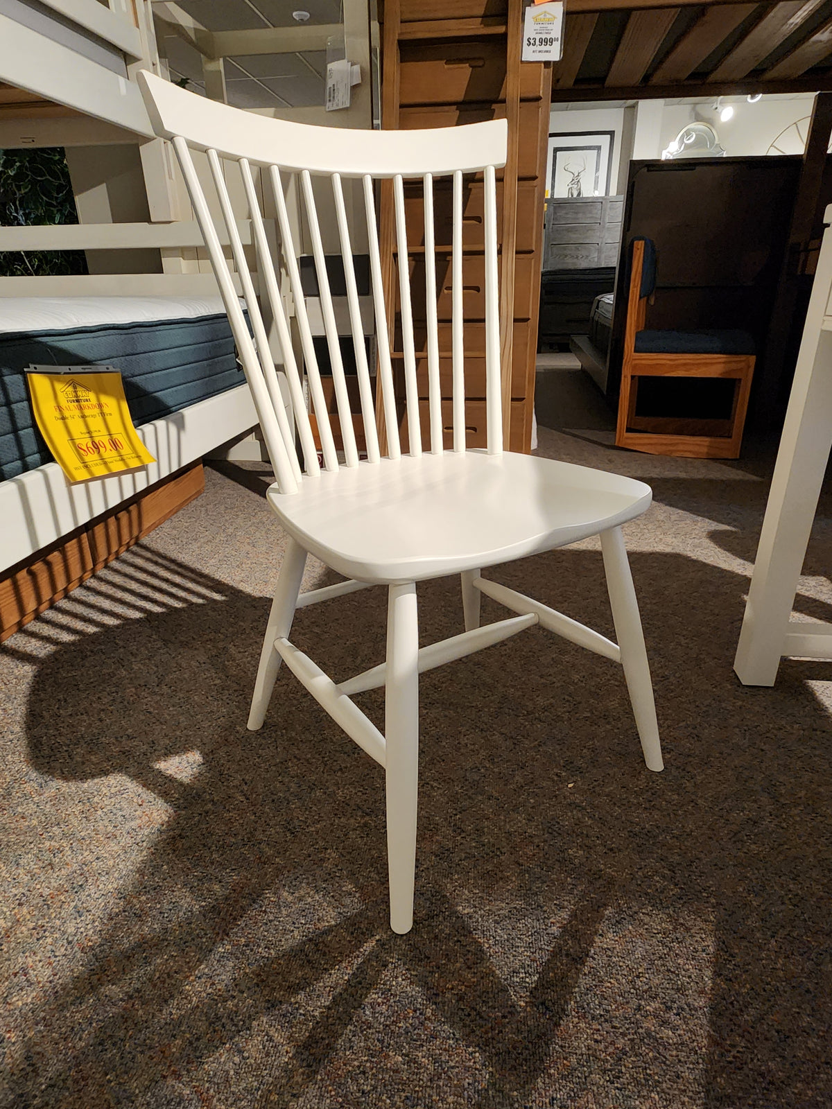 The 834 Laptop Desk Chair by Ben & Erin Napier for Vaughan Bassett is a white wooden chair with vertical slats.