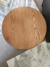 The Rory 22" End Table by Donald Choi features a round black oak veneer top, perfect for small spaces and accent use.