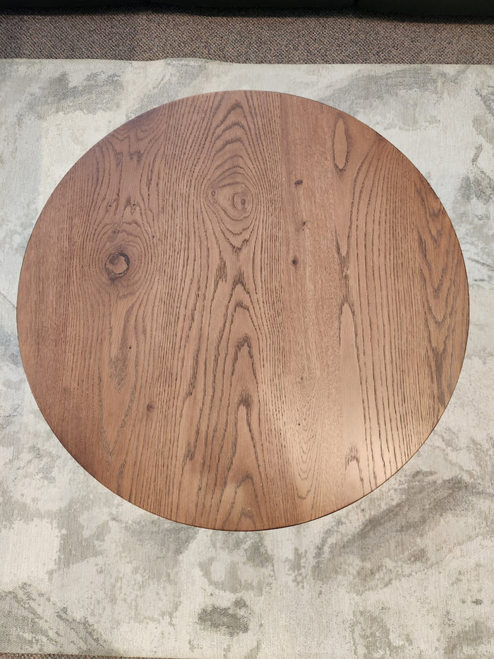 The Rory 29" Coffee Table by Donald Choi features visible grain, ideal for small spaces, on a textured light rug.