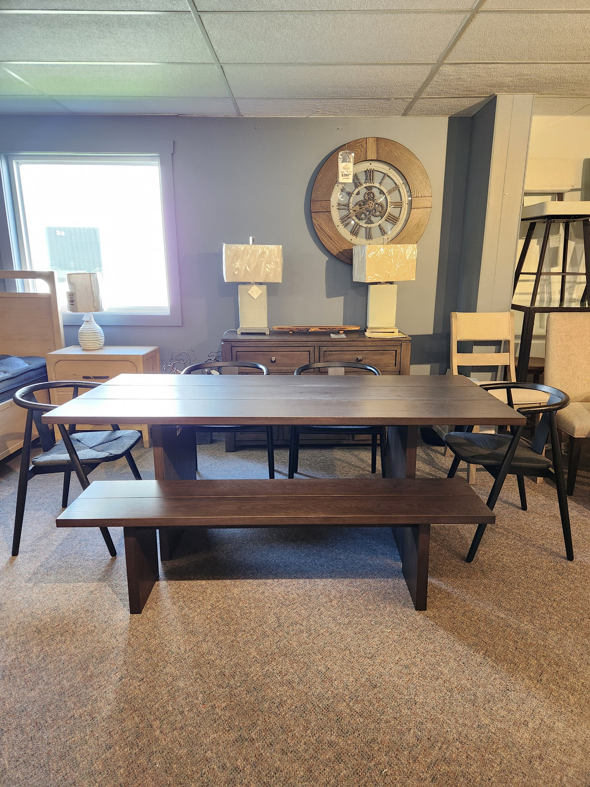 The Palliser EQ3 Homework 5 Piece Dining Table Set displays quality craftsmanship in a stylish furniture showroom.