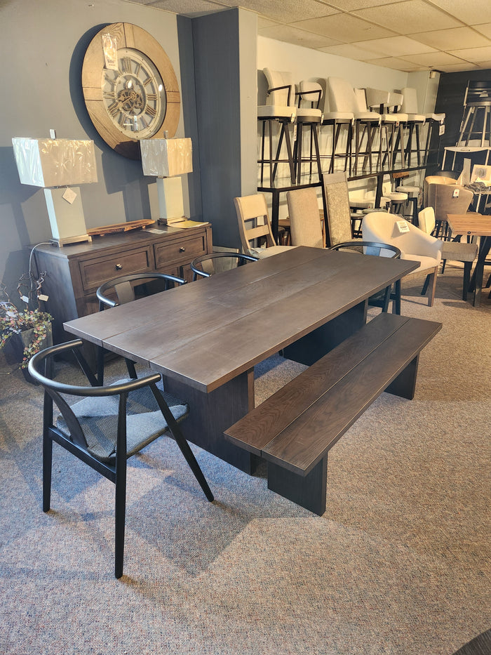 The Palliser EQ3 Homework 5 Piece Dining Table Set features quality craftsmanship with a bench and chairs on display.