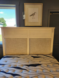 The Magnussen B6310 - Echo Isles Bed features a beige upholstered headboard and transitional casual style.