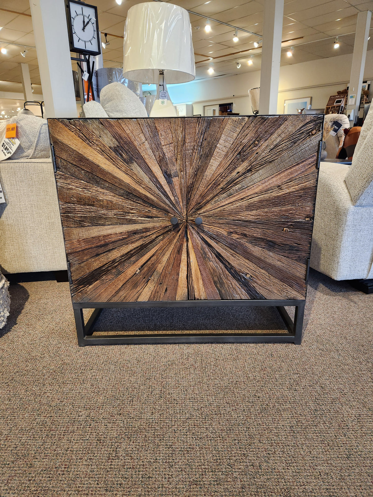 The Jofran 1928 Astral Plains 2 Door Cabinet features a starburst front, perfect for any showroom display.