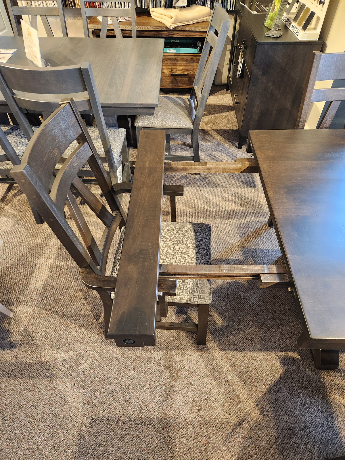 A Handstone RA4284 Rafters Dining chair with its seat removed displays the inner frame next to a dining package set.