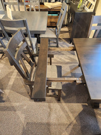 A Handstone RA4284 Rafters Dining chair with its seat removed displays the inner frame next to a dining package set.