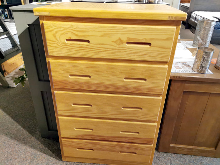 The Crate A7015 5 Drawer Chest features dovetailed corners and cutout handles, shown on a carpeted floor.