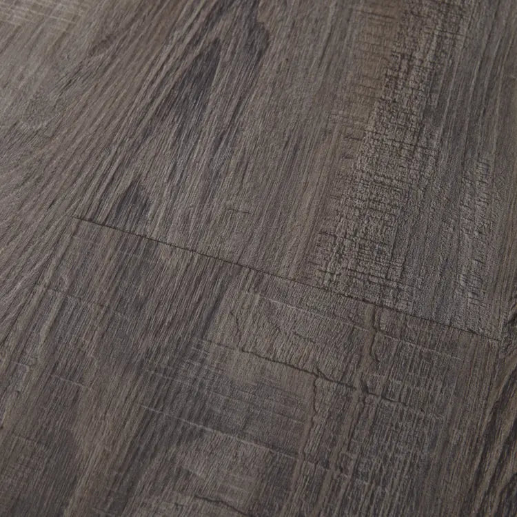 Close-up of Mannington Adura Flex Sausalito Waterfront—textured dark brown planks with visible grain and natural patterns.
